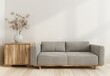© PERFECTisME - Minimalist living room interior with a gray sofa. wooden side table. and dried flowers in a white vase against a white wall