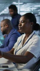Poster - vertical video focus on server hub employee developing disaster recovery plans ensuring minimal down