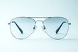 © Michael - Stylish aviator sunglasses with blue lenses are showcased against a clean white backdrop, emphasizing their sleek design and timeless appeal