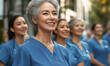© Ignacio Ferrándiz - A group of nurses are smiling and wearing blue scrubs
