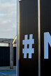 © Connect Images - A large hashtag symbol displayed prominently on a brown metallic panel next to a partial letter, Berlin, Germany