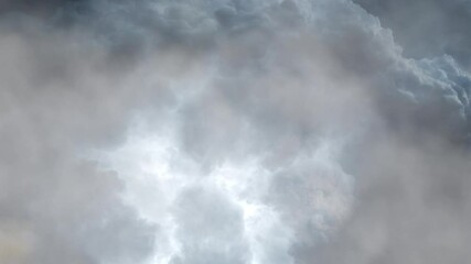 Wall Mural - thunderbolt and storm in the dark clouds with white clouds.
