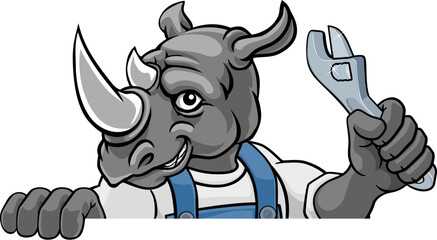 Wall Mural - A rhino cartoon animal mascot plumber, mechanic or handyman builder construction maintenance contractor peeking around a sign holding a spanner or wrench