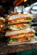 © Woranuch - Delicious Spicy Tofu Sandwich with Cilantro and Orange Sauce on Rustic Wooden Board.
