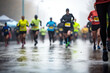 © ty - An anonymous crowd of sports people running marathon outdoors on rainy day
