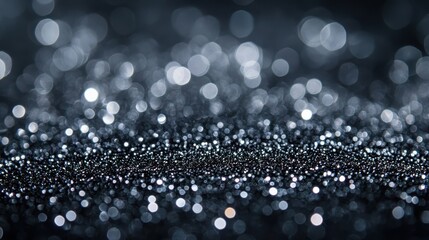 Poster - silver glitter bokeh effect against a black background, festive abstract design for christmas celebr