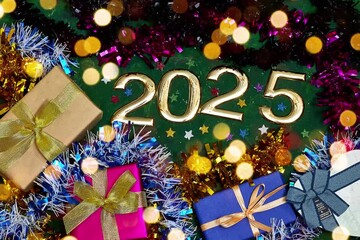 Wall Mural - golden numbers 2025 two thousand twenty five new year with tinsels and gift box