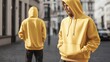 © WhataWin - Model wearing yellow Hoodie Mockup