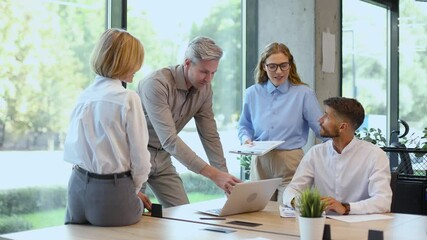 Wall Mural - Startup business team on meeting in modern bright office interior and working on laptop