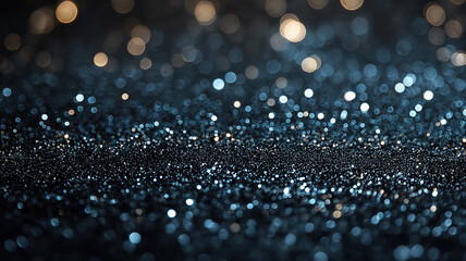 Poster - Sparkling Blue and Gold Bokeh Background for Festive Design. A captivating bokeh background featuring a gradient of shimmering gold and blue lights on a dark surface.