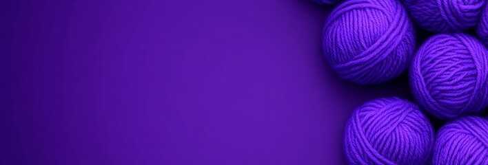 Poster - Purple background with a bunch of purple yarn balls on it. The yarn balls are arranged in a row and are of different sizes. The image has a calming and soothing mood, as the purple background
