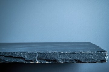 Aufkleber - A close-up view of a stone shelf on a wall with intricate carvings and textures