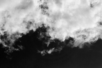 Wall Mural - clouds over black.