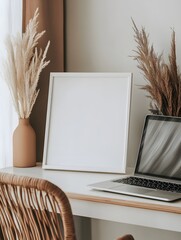 Canvas Print - A blank white frame resting on a shelf, with part of a desk, laptop, and chair in the foreground creating a natural workspace scene.