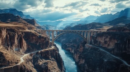 Poster - Captivating aerial view of a historic bridge spanning a river in a dramatic canyon landscape during daytime