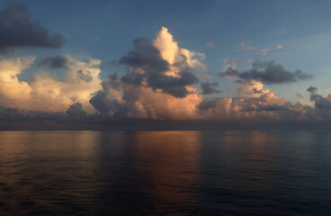 Wall Mural - Morning clouds over calm Caribbean Sea