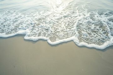 Poster - Gentle waves lap against a sandy shore under bright sunlight near a tranquil ocean