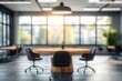 © zong - Modern Office Interior in Soft Focus with Round Table and Black Chairs, Bright Natural Light, Minimalist Design Elements