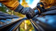 © Ira - Close Up of Worker Installing Plastic Pipe for Gutter System on Roof with Natural Lighting