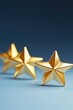 © MK - Three gold stars on a blue surface