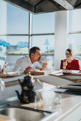 Wall Mural - A diverse group of business employees taking a break in a modern office kitchen, sharing pizza and engaging in friendly conversation, highlighting a relaxed corporate atmosphere.