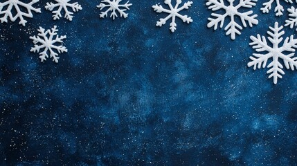 Wall Mural - Winter Wonderland Background with White Snowflakes on Deep Blue Texture for Holiday and Festive Designs