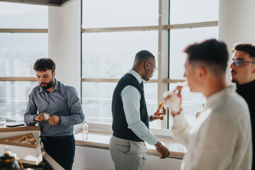 Wall Mural - A diverse group of business people enjoy a relaxed break in a modern office setting, fostering teamwork and collaboration. They are seen eating snacks and engaging in light conversation.