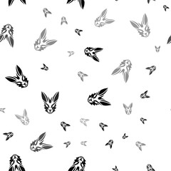 Poster - Seamless vector pattern with hare's head symbols, creating a creative monochrome background with rotated elements. Illustration on transparent background