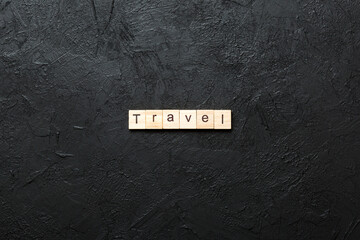 Wall Mural - Travel word written on wood block. Travel text on cement table for your desing, concept