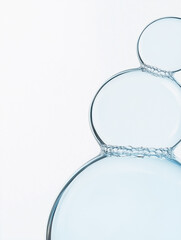 Wall Mural - blue glass bubbles, , cosmetic moisturizing water molecules, cosmetic essence, liquid oil foam, glas