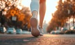 © MdRased - Runner feet running on road closeup on shoe. woman fitness sunrise jog workout welness concept