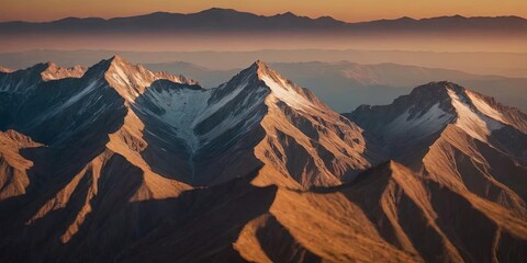 Poster - The mountains are covered in snow and the sun is setting