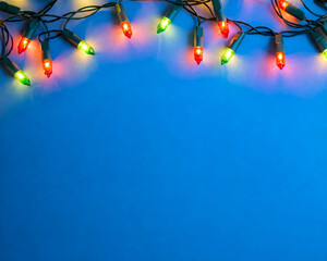 Wall Mural - christmas colorful light border on blue background