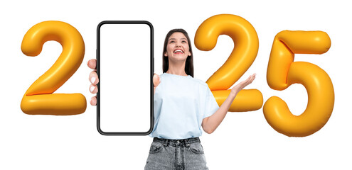 Poster - Happy woman showing blank smartphone screen, surrounded by yellow 2025 balloons on white background. Concept for New Year, tech, forecast