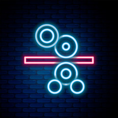 Poster - Glowing neon line Paper roll of a printing press icon isolated on brick wall background. Colorful outline concept. Vector
