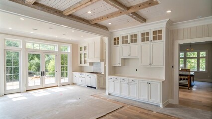 Aufkleber - A bright openplan living area where whitepainted kitchen cabinetry stands stark against exposed drywall ready for the next coat of paint.