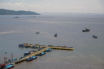 Wall Mural - A view of a port with a drained seaside