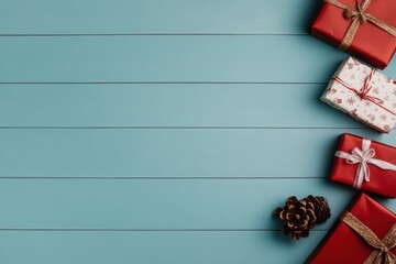 Wall Mural - Christmas gift boxes and pine cone resting on light blue wooden planks