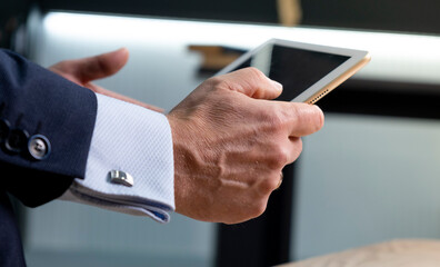 businessman touching screen of a tablet computer.