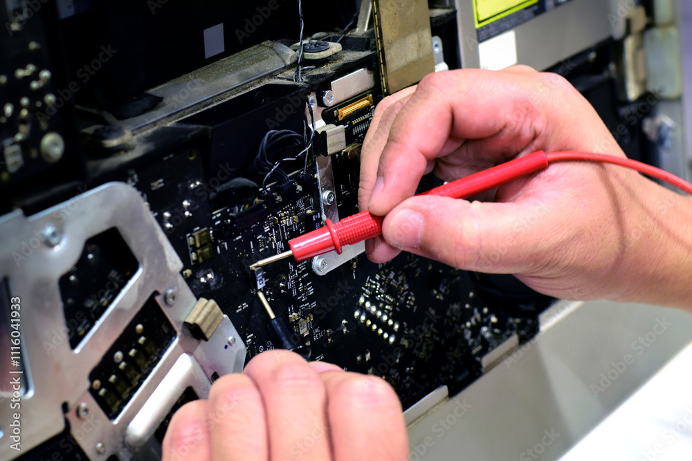 computer technician technician A laptop motherboard repairman is using ...