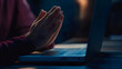 © Daniel - Hands together in prayer for god blessing to wish to have a better life. man hands praying to god with the bible on his laptop. believe in goodness. spirituality and religion, and bible prayer online