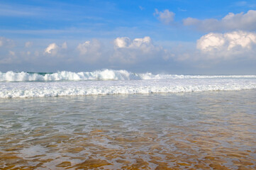 Poster - Sea and bright blue cloudy sky.