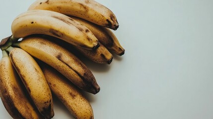 Aufkleber - Ripe raw bananas arranged on a clean white background showcasing their natural texture and color for culinary and lifestyle themes.