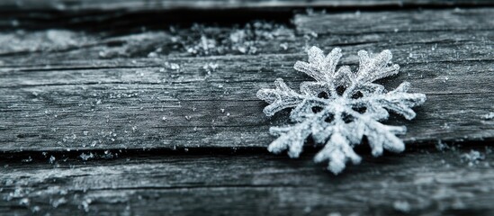 Poster - Christmas snowflake decoration on rustic timber surface with frost and snow for holiday themed backgrounds and seasonal design.