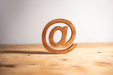 Wall Mural - email symbol with wooden background