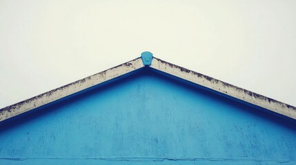 Poster - Blue modern building wall with abstract architectural design against a white backdrop highlighting symmetry and minimalist aesthetic.