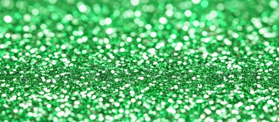 Poster - Green glitter texture with soft bokeh effect ideal for backgrounds or overlays in creative projects showcasing vibrant color and shine.