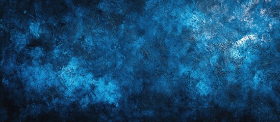 Leinwandbilder - Textured abstract background showcasing a blend of deep blue hues and cloudy elements for artistic and design applications.