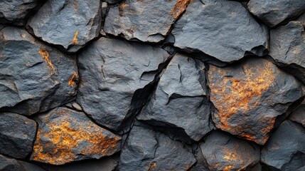 Poster - Rough surface texture of a layered rock wall featuring dark gray stones with rust-colored accents, showcasing natural geological patterns, background, nature, abstract design.