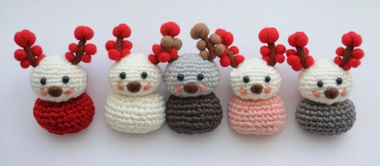 Poster - Handmade charming reindeer pom pom gift boxes arranged in a delightful flat lay showcasing festive colors and textures.